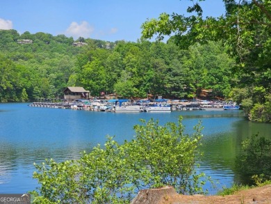 Nestled within the serene and exclusive Big Canoe community in on Big Canoe Golf Club - Cherokee in Georgia - for sale on GolfHomes.com, golf home, golf lot