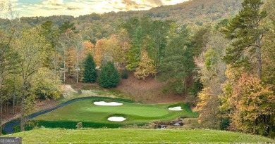Nestled within the serene and exclusive Big Canoe community in on Big Canoe Golf Club - Cherokee in Georgia - for sale on GolfHomes.com, golf home, golf lot