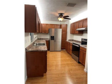 Welcome to a beautifully maintained gem sitting proudly on an on Golden Gate Country Club in Florida - for sale on GolfHomes.com, golf home, golf lot