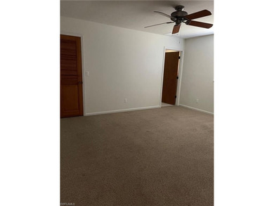 Welcome to a beautifully maintained gem sitting proudly on an on Golden Gate Country Club in Florida - for sale on GolfHomes.com, golf home, golf lot