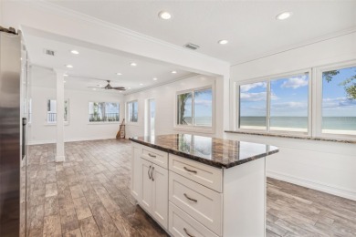 Discover your beachfront oasis directly on Tampa Bay! Step out on Key Royale Club in Florida - for sale on GolfHomes.com, golf home, golf lot