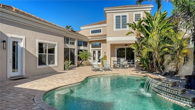 Located within the gated Queens Harbour enclave in Bay Isles on Longboat Key Golf Club Resort in Florida - for sale on GolfHomes.com, golf home, golf lot