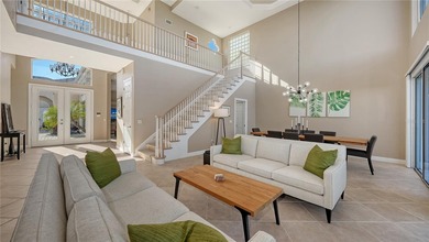 Located within the gated Queens Harbour enclave in Bay Isles on Longboat Key Golf Club Resort in Florida - for sale on GolfHomes.com, golf home, golf lot