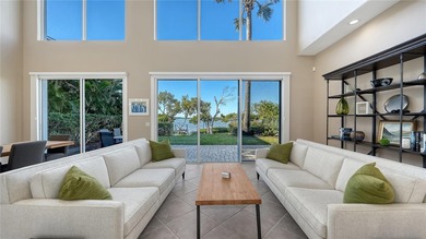 Located within the gated Queens Harbour enclave in Bay Isles on Longboat Key Golf Club Resort in Florida - for sale on GolfHomes.com, golf home, golf lot