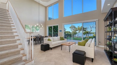 Located within the gated Queens Harbour enclave in Bay Isles on Longboat Key Golf Club Resort in Florida - for sale on GolfHomes.com, golf home, golf lot