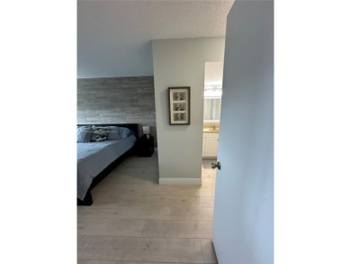 Discover this charming condo with 2 bedrooms and 2 bathrooms on Pembroke Lakes Golf Club in Florida - for sale on GolfHomes.com, golf home, golf lot