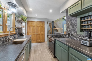 Step inside this spacious, contemporary home filled with soaring on Lake Monticello Golf Course in Virginia - for sale on GolfHomes.com, golf home, golf lot