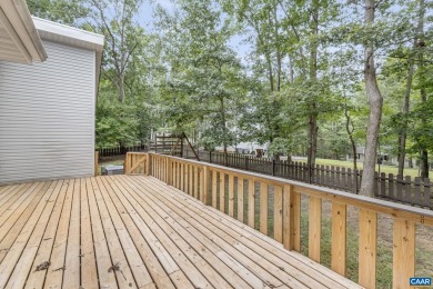 Step inside this spacious, contemporary home filled with soaring on Lake Monticello Golf Course in Virginia - for sale on GolfHomes.com, golf home, golf lot