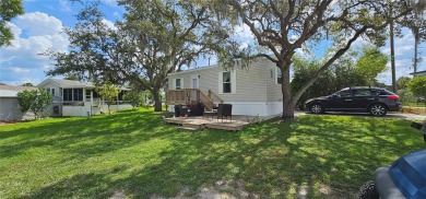 This charming 2022 Factory Expo Direct Park Model sits on one of on Glen Lakes Country Club in Florida - for sale on GolfHomes.com, golf home, golf lot
