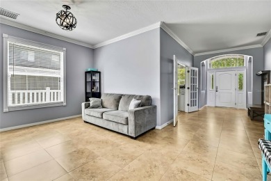 Commanding golf course views and elegant architectural details on Heritage Harbor Golf and Country Club in Florida - for sale on GolfHomes.com, golf home, golf lot