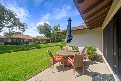 Spectacular turnkey 2BR/2BA Club Cottage with serene canal views on PGA National Golf Club in Florida - for sale on GolfHomes.com, golf home, golf lot