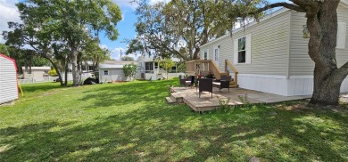 This charming 2022 Factory Expo Direct Park Model sits on one of on Glen Lakes Country Club in Florida - for sale on GolfHomes.com, golf home, golf lot
