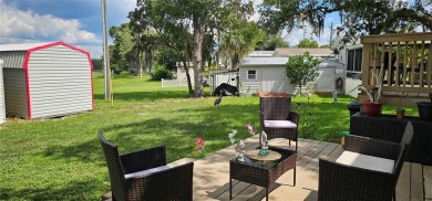 This charming 2022 Factory Expo Direct Park Model sits on one of on Glen Lakes Country Club in Florida - for sale on GolfHomes.com, golf home, golf lot