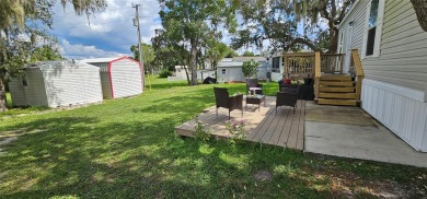 This charming 2022 Factory Expo Direct Park Model sits on one of on Glen Lakes Country Club in Florida - for sale on GolfHomes.com, golf home, golf lot