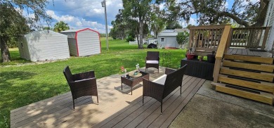 This charming 2022 Factory Expo Direct Park Model sits on one of on Glen Lakes Country Club in Florida - for sale on GolfHomes.com, golf home, golf lot