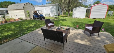 This charming 2022 Factory Expo Direct Park Model sits on one of on Glen Lakes Country Club in Florida - for sale on GolfHomes.com, golf home, golf lot