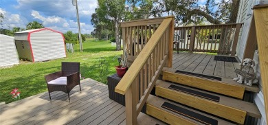 This charming 2022 Factory Expo Direct Park Model sits on one of on Glen Lakes Country Club in Florida - for sale on GolfHomes.com, golf home, golf lot