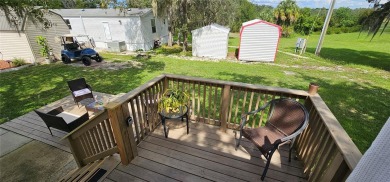 This charming 2022 Factory Expo Direct Park Model sits on one of on Glen Lakes Country Club in Florida - for sale on GolfHomes.com, golf home, golf lot