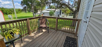 This charming 2022 Factory Expo Direct Park Model sits on one of on Glen Lakes Country Club in Florida - for sale on GolfHomes.com, golf home, golf lot