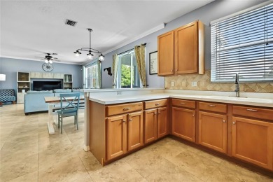 Commanding golf course views and elegant architectural details on Heritage Harbor Golf and Country Club in Florida - for sale on GolfHomes.com, golf home, golf lot