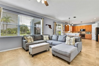 Commanding golf course views and elegant architectural details on Heritage Harbor Golf and Country Club in Florida - for sale on GolfHomes.com, golf home, golf lot