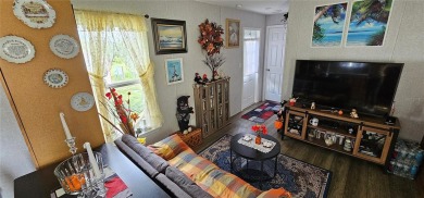 This charming 2022 Factory Expo Direct Park Model sits on one of on Glen Lakes Country Club in Florida - for sale on GolfHomes.com, golf home, golf lot