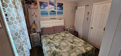 This charming 2022 Factory Expo Direct Park Model sits on one of on Glen Lakes Country Club in Florida - for sale on GolfHomes.com, golf home, golf lot