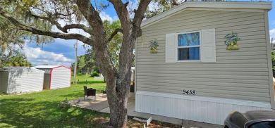 This charming 2022 Factory Expo Direct Park Model sits on one of on Glen Lakes Country Club in Florida - for sale on GolfHomes.com, golf home, golf lot