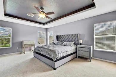 Commanding golf course views and elegant architectural details on Heritage Harbor Golf and Country Club in Florida - for sale on GolfHomes.com, golf home, golf lot