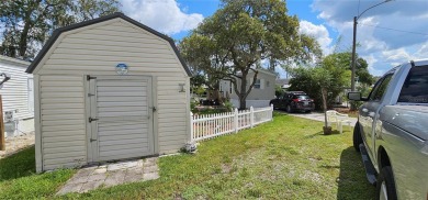 This charming 2022 Factory Expo Direct Park Model sits on one of on Glen Lakes Country Club in Florida - for sale on GolfHomes.com, golf home, golf lot