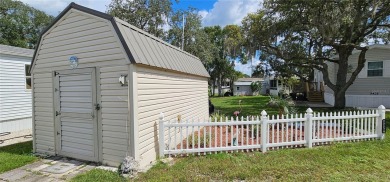 This charming 2022 Factory Expo Direct Park Model sits on one of on Glen Lakes Country Club in Florida - for sale on GolfHomes.com, golf home, golf lot