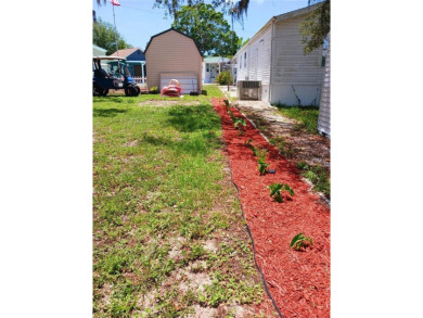 This charming 2022 Factory Expo Direct Park Model sits on one of on Glen Lakes Country Club in Florida - for sale on GolfHomes.com, golf home, golf lot