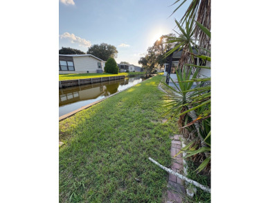 Very spacious canal front two bedroom, two bath home with a on Golden Lakes Golf Course in Florida - for sale on GolfHomes.com, golf home, golf lot