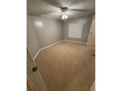 Very spacious canal front two bedroom, two bath home with a on Golden Lakes Golf Course in Florida - for sale on GolfHomes.com, golf home, golf lot