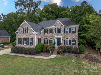 Lake living is calling you! This beautiful full brick stately on Westport Golf Club in North Carolina - for sale on GolfHomes.com, golf home, golf lot