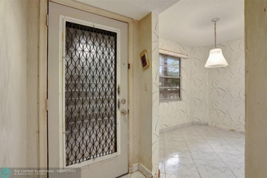 SALE OF THE CENTURY IN VIBRANT & HIGHLY SOUGHT AFTER WYNMOOR! on Wynmoor Golf Course in Florida - for sale on GolfHomes.com, golf home, golf lot