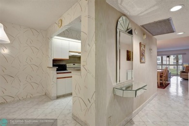 SALE OF THE CENTURY IN VIBRANT & HIGHLY SOUGHT AFTER WYNMOOR! on Wynmoor Golf Course in Florida - for sale on GolfHomes.com, golf home, golf lot