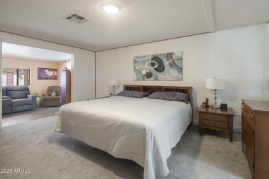Enjoy the best of Arizona living in this updated 2-bedroom on Fountain of the Sun Country Club in Arizona - for sale on GolfHomes.com, golf home, golf lot