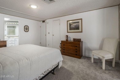 Enjoy the best of Arizona living in this updated 2-bedroom on Fountain of the Sun Country Club in Arizona - for sale on GolfHomes.com, golf home, golf lot