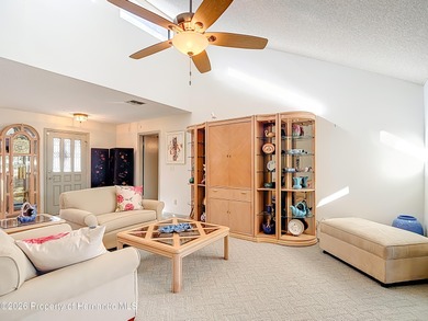 Welcome to your dream home in Whispering Oaks, where comfort on The Ridge Manor Oaks Golf and Country Club in Florida - for sale on GolfHomes.com, golf home, golf lot