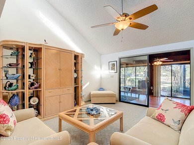 Welcome to your dream home in Whispering Oaks, where comfort on The Ridge Manor Oaks Golf and Country Club in Florida - for sale on GolfHomes.com, golf home, golf lot