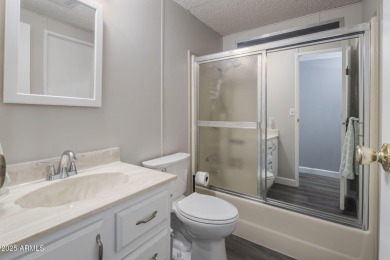 Enjoy the best of Arizona living in this updated 2-bedroom on Fountain of the Sun Country Club in Arizona - for sale on GolfHomes.com, golf home, golf lot