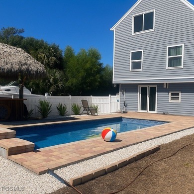 TROPICAL ISLAND RETREAT - 4 BEDROOMS - 3 BATHROOMS POOL HOME on Alden Pines Golf Club in Florida - for sale on GolfHomes.com, golf home, golf lot