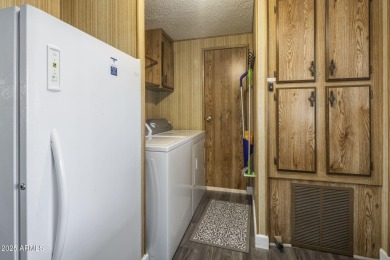 Enjoy the best of Arizona living in this updated 2-bedroom on Fountain of the Sun Country Club in Arizona - for sale on GolfHomes.com, golf home, golf lot