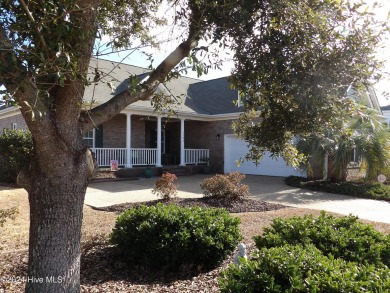 This beautifully maintained, custom canal-front home in on Magnolia Greens Golf Plantation in North Carolina - for sale on GolfHomes.com, golf home, golf lot