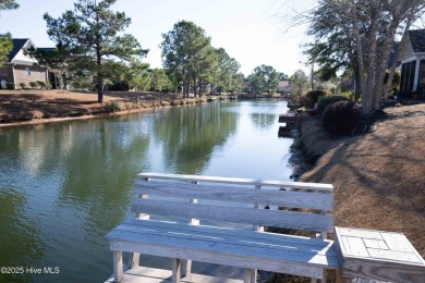 This beautifully maintained, custom canal-front home in on Magnolia Greens Golf Plantation in North Carolina - for sale on GolfHomes.com, golf home, golf lot