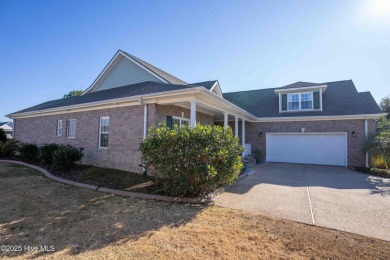 This beautifully maintained, custom canal-front home in on Magnolia Greens Golf Plantation in North Carolina - for sale on GolfHomes.com, golf home, golf lot