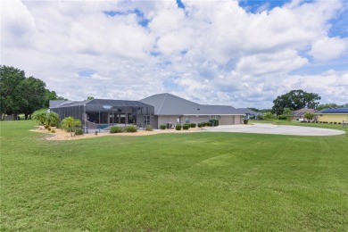 STUNNING GOLF FRONT OASIS WITH RESORT-STYLE OUTDOOR LIVING on Miona Lake Golf Club in Florida - for sale on GolfHomes.com, golf home, golf lot