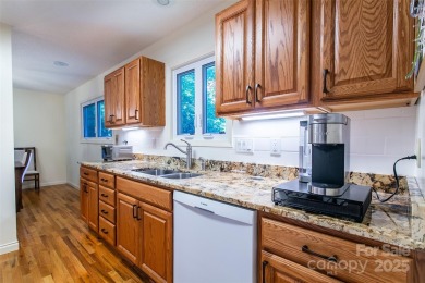 On the 12th hole of the acclaimed Connestee Falls golf course on Connestee Falls Golf Club in North Carolina - for sale on GolfHomes.com, golf home, golf lot