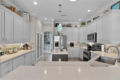 STUNNING GOLF FRONT OASIS WITH RESORT-STYLE OUTDOOR LIVING on Miona Lake Golf Club in Florida - for sale on GolfHomes.com, golf home, golf lot